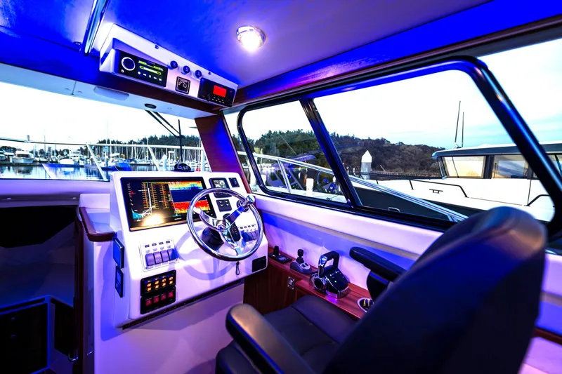 Slide: The Image of Top view of 2026 Ocean Sport 33 Cummins Shaft Drive yacht on clear water. - 4