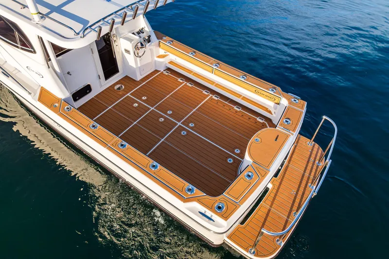 Slide: The Image of Interior of 2026 Ocean Sport 33 Cummins Shaft Drive boat with modern amenities. - 6