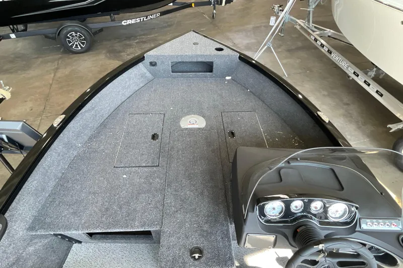 Slide: The Image of 2026 Crestliner 1650 Fish Hawk SC boat interior with dashboard and storage compartments. - 16