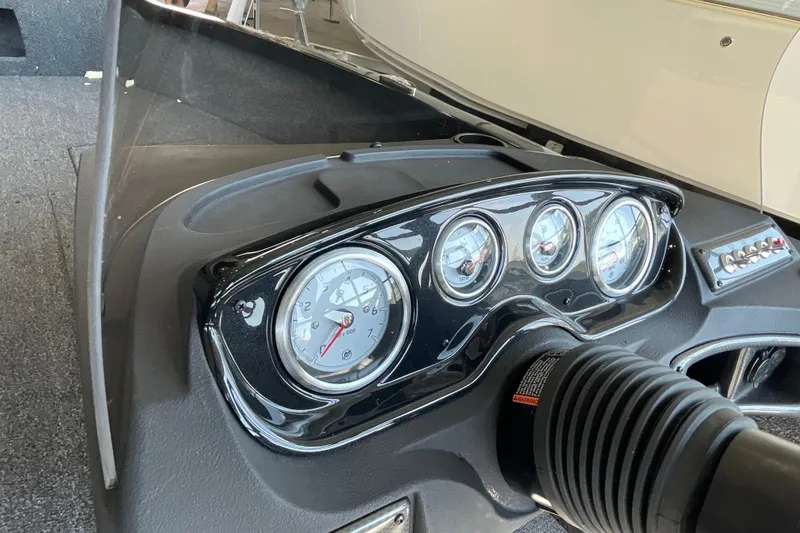 Slide: The Image of 2026 Crestliner 1650 Fish Hawk SC dashboard with gauges and controls. - 9