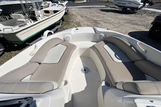 Slide: The Image of 2004 Sea Ray 220 Sundeck boat with spacious seating and modern design. - 11
