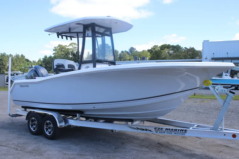 The Image of 2026 Tidewater 220 CC Adventure boat on trailer, parked outdoors. - 0
