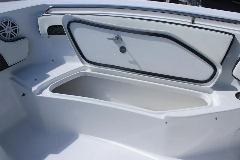 Slide: The Image of 2026 Tidewater 220 CC Adventure boat storage compartment, open and empty. - 10