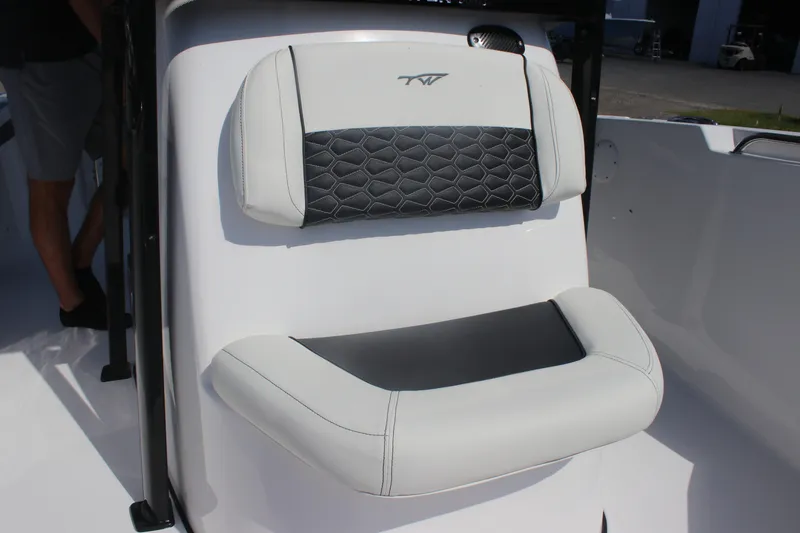 Slide: The Image of 2026 Tidewater 220 CC Adventure boat seat with stylish black and white upholstery. - 11
