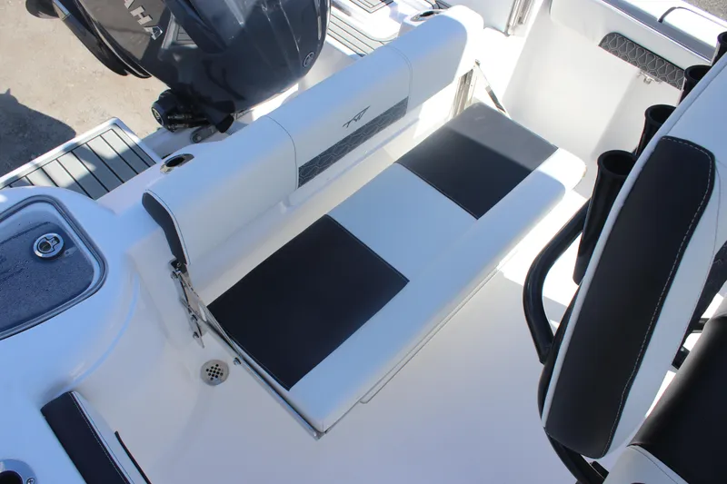 Slide: The Image of 2026 Tidewater 220 CC Adventure boat interior with seating and Yamaha engine. - 18