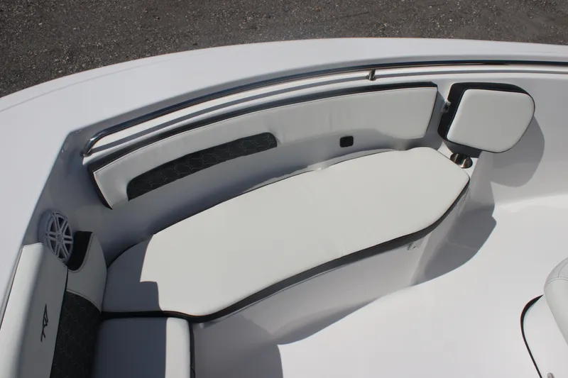 Slide: The Image of 2026 Tidewater 220 CC Adventure boat interior with white cushioned seating. - 19