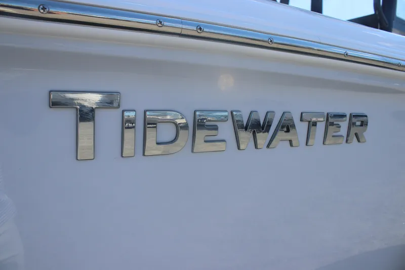 Slide: The Image of 2026 Tidewater 220 CC Adventure boat logo on white hull. - 20