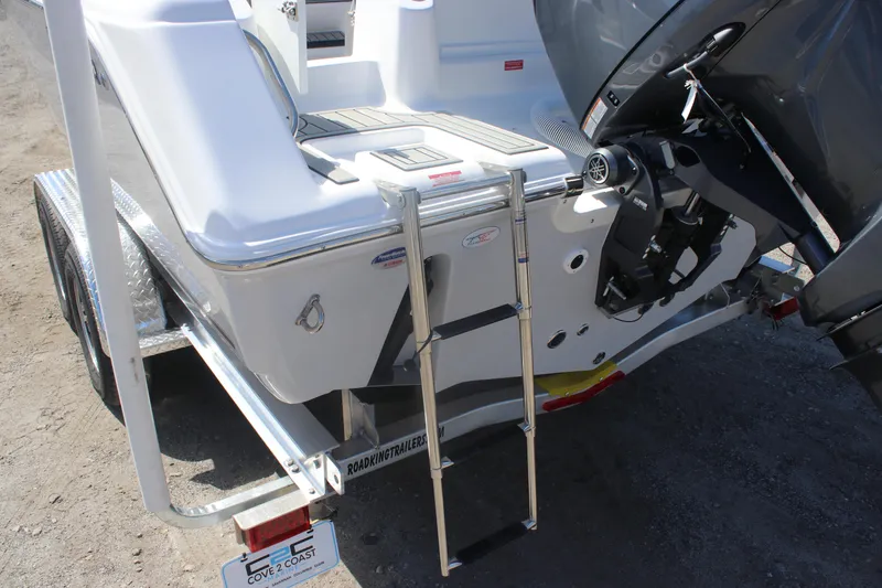 Slide: The Image of 2026 Tidewater 220 CC Adventure boat with ladder and motor on trailer. - 8