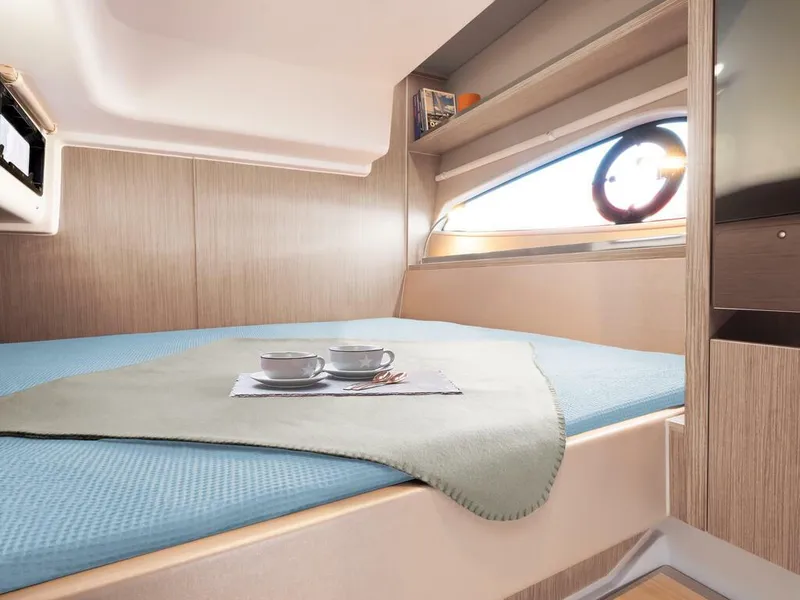 Slide: The Image of Interior of 2026 Sealine S335V yacht cabin with cozy bed and window view. - 17