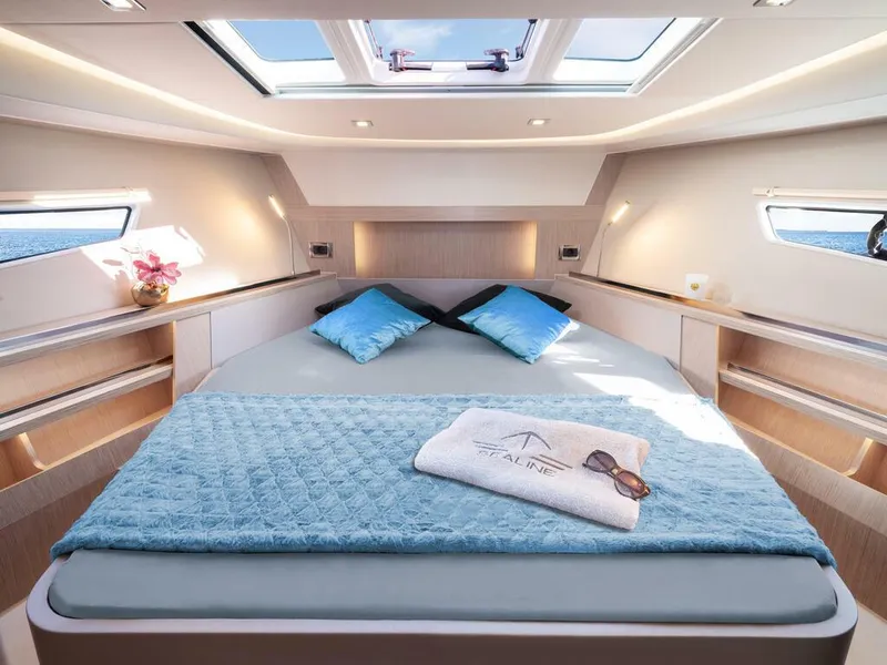 Slide: The Image of Luxurious interior of 2026 Sealine S335V yacht with skylight and elegant bedding. - 18
