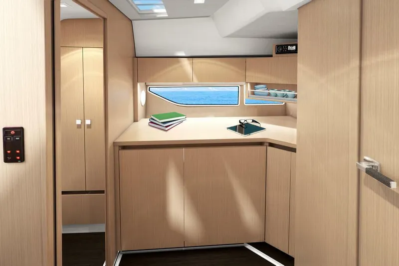 Slide: The Image of Interior of 2026 Sealine S335V yacht with modern wood cabinetry and ocean view window. - 24
