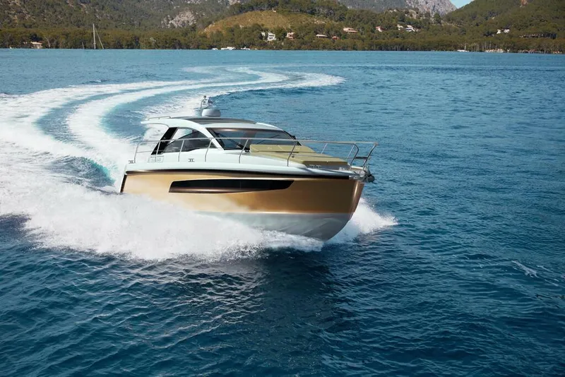 Slide: The Image of 2026 Sealine S335V yacht cruising on open water, creating a dynamic wake. - 4