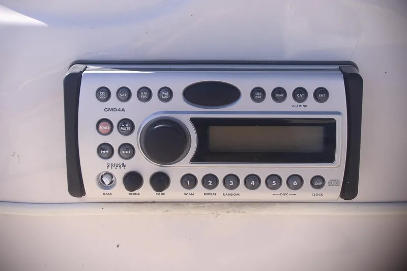 Slide: The Image of 2007 Sundancer Pontoons 24LX stereo system, CMD4A model, featuring various control buttons. - 12