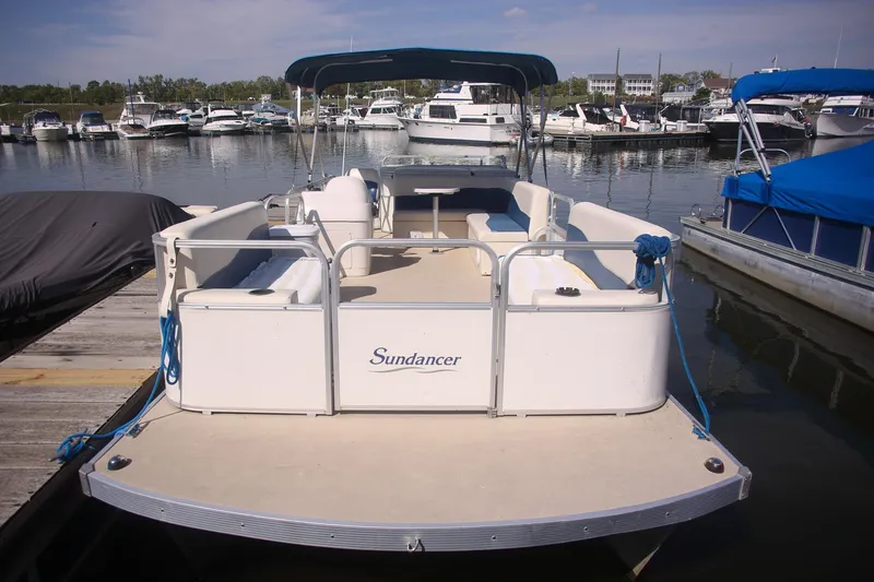 Slide: The Image of 2007 Sundancer Pontoons 24LX boat docked at marina with blue canopy. - 4