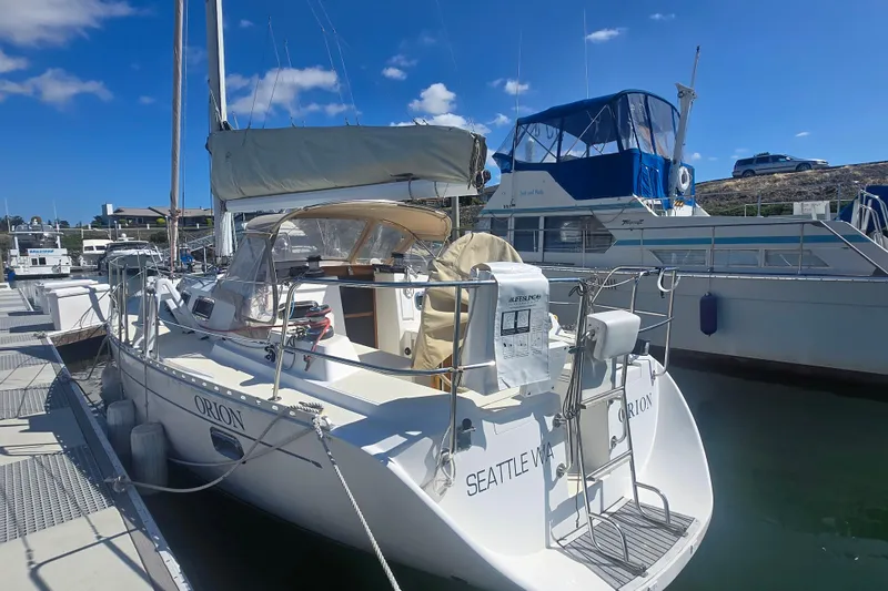 The Image of Sailboat docked at marina, Freedom 35 model, 1997, under clear blue sky. - 0