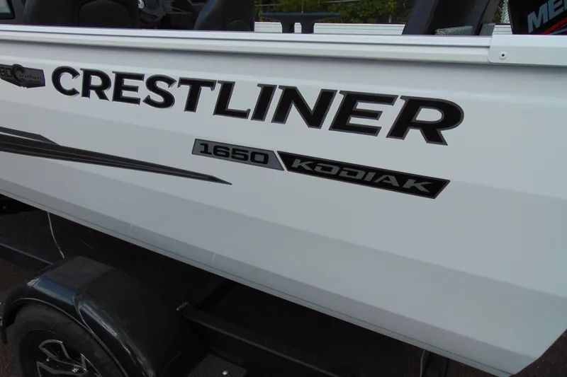 Slide: The Image of 2026 Crestliner 1650 Kodiak boat side view with logo and model name. - 3
