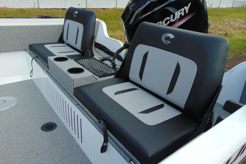 Slide: The Image of 2026 Crestliner 1650 Kodiak boat seats with cup holders and Mercury engine. - 6