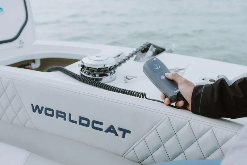 Slide: The Image of 2026 World Cat 235TE boat interior with anchor control, featuring quilted seating. - 17