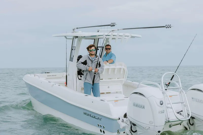 Slide: The Image of 2026 World Cat 235TE boat with two people fishing, equipped with Yamaha engines. - 20