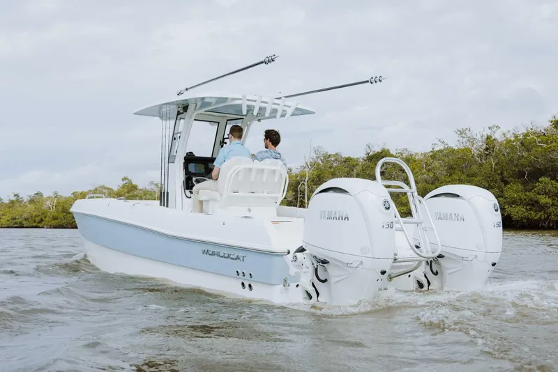 Slide: The Image of 2026 World Cat 235TE boat cruising on water with dual Yamaha engines. - 28