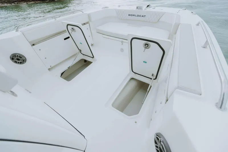 Slide: The Image of 2026 World Cat 235TE boat interior with open storage compartments and seating. - 33
