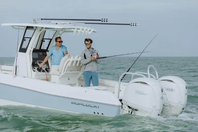 Slide: The Image of Two people fishing on a 2026 World Cat 235TE boat in open water. - 4
