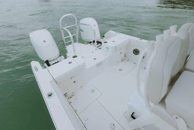 Slide: The Image of 2026 World Cat 235TE boat with dual engines on calm water. - 43