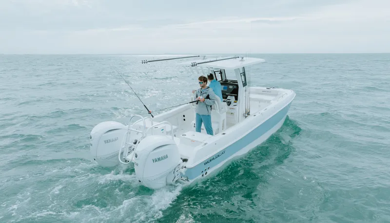 Slide: The Image of 2026 World Cat 235TE boat with Yamaha engines, fishing in open sea. - 7