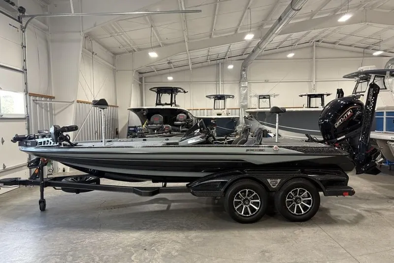 The Image of 2026 Skeeter FXR20 Apex bass boat in a showroom, featuring sleek design and powerful engine. - 1