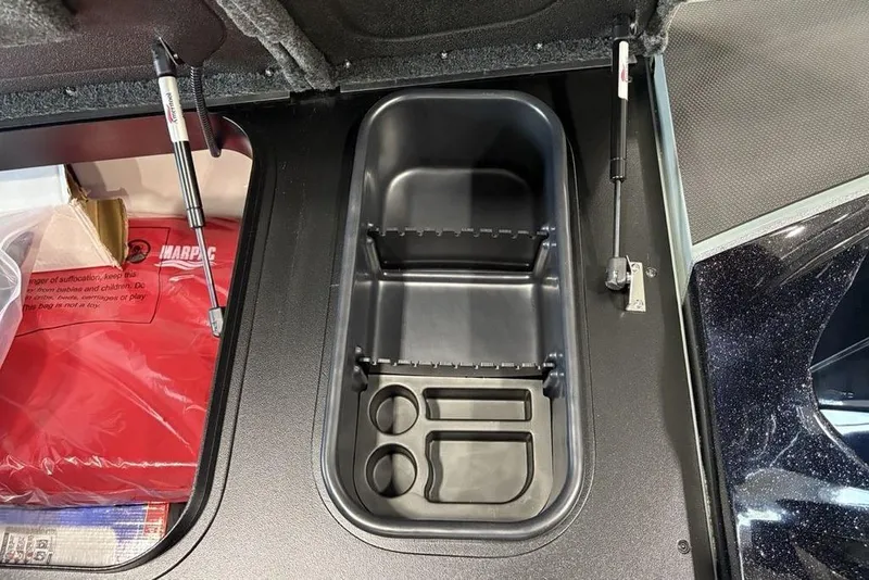 Slide: The Image of 2026 Skeeter FXR20 Apex storage compartment with organized interior layout. - 13