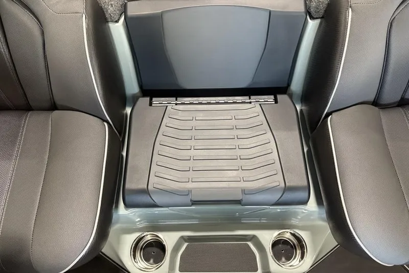 Slide: The Image of 2026 Skeeter FXR20 Apex boat interior with black seating and storage compartment. - 18