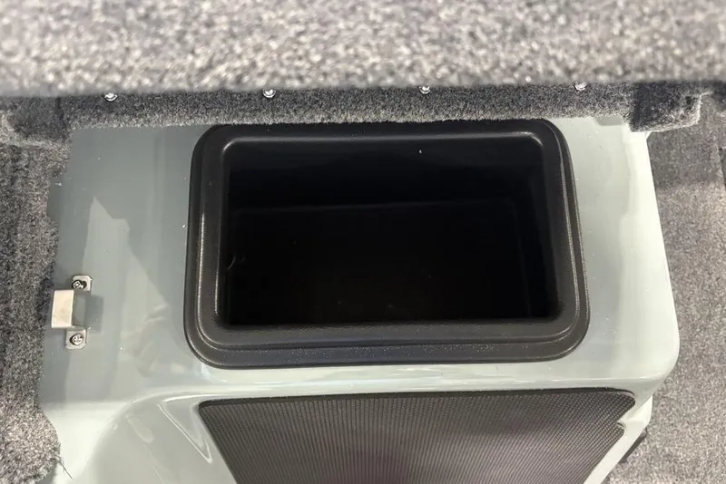 Slide: The Image of 2026 Skeeter FXR20 Apex storage compartment with carpeted interior and secure latch. - 19