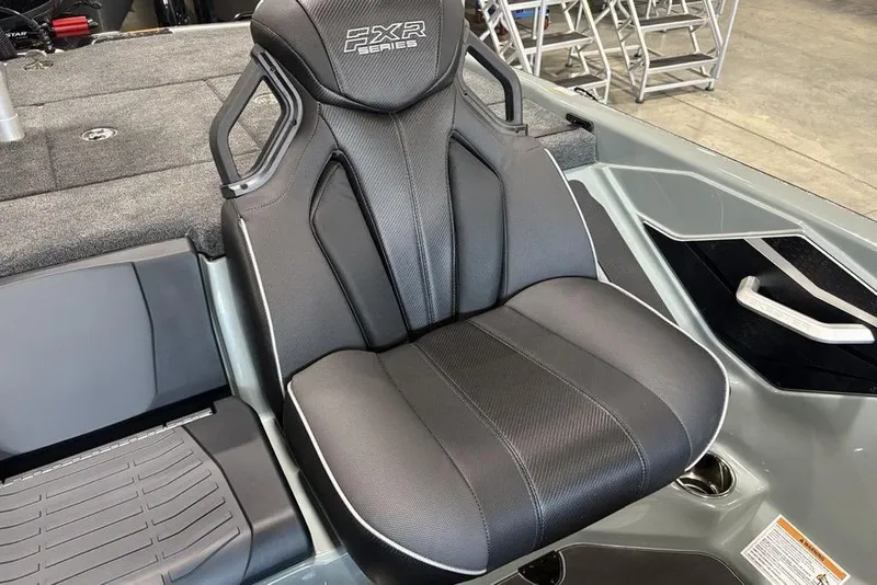 Slide: The Image of 2026 Skeeter FXR20 Apex boat seat, black upholstery, ergonomic design, modern interior. - 20