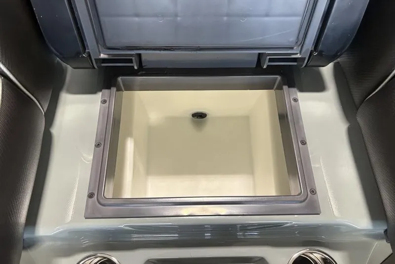 Slide: The Image of 2026 Skeeter FXR20 Apex boat storage compartment, open and empty. - 23