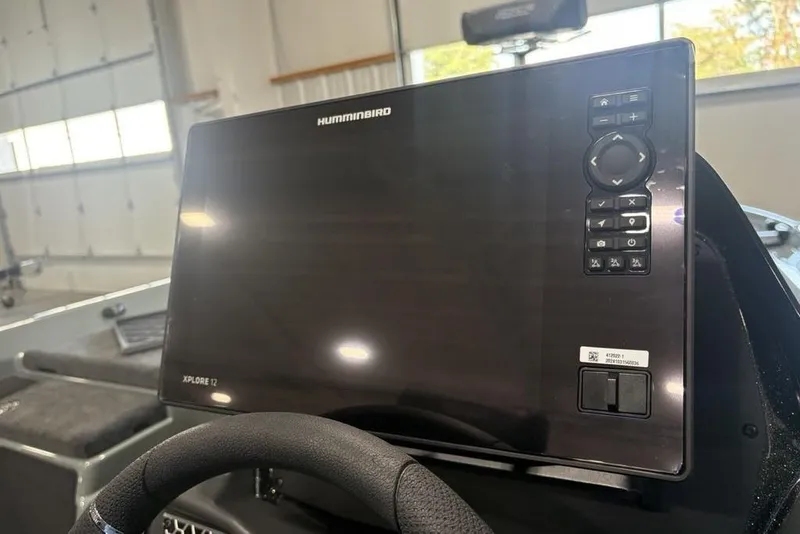 Slide: The Image of 2026 Skeeter FXR20 Apex boat with Humminbird Xplore 12 display in cockpit. - 24
