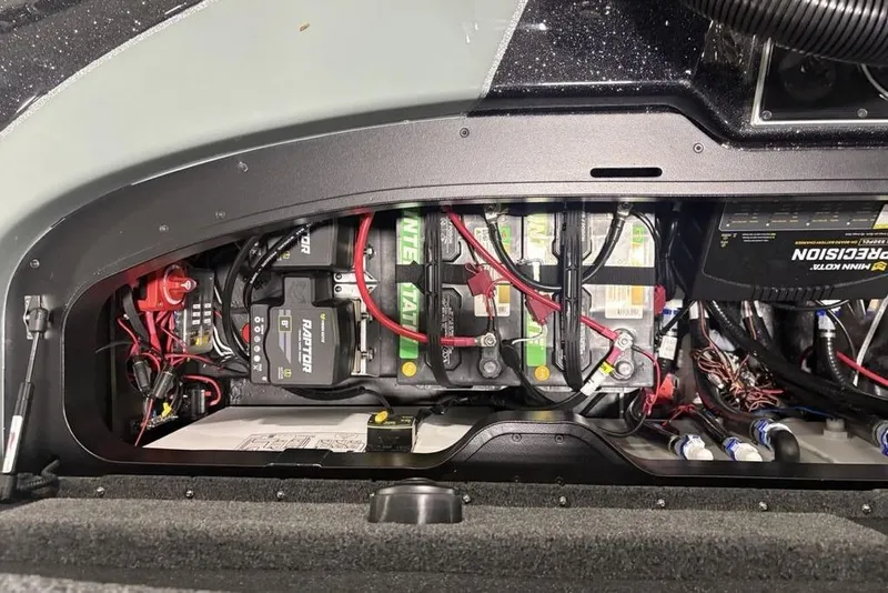 Slide: The Image of 2026 Skeeter FXR20 Apex battery compartment with wiring and components. - 30