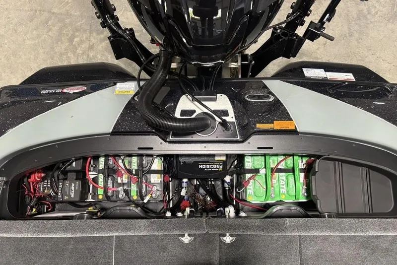 Slide: The Image of 2026 Skeeter FXR20 Apex boat battery compartment with multiple batteries and wiring. - 32