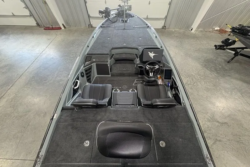 Slide: The Image of 2026 Skeeter FXR20 Apex boat interior with sleek black seating and modern dashboard. - 35