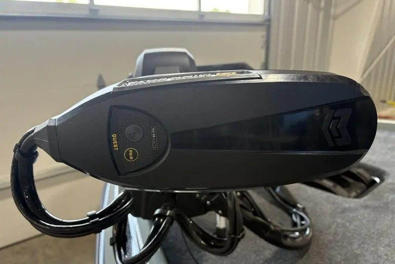 Slide: The Image of 2026 Skeeter FXR20 Apex boat motor detail in a garage setting. - 4