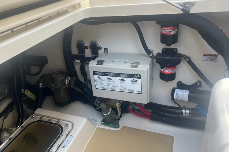 Slide: The Image of Engine compartment of 2020 Scout 380 LXF boat, showing fuel filters and wiring. - 22