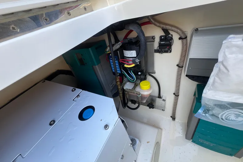 Slide: The Image of Engine compartment of a 2020 Scout 380 LXF boat, showcasing wiring and components. - 27