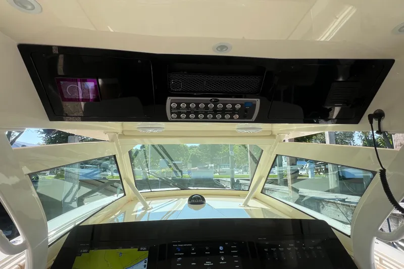 Slide: The Image of Interior view of 2020 Scout 380 LXF boat cockpit with control panel and navigation system. - 29