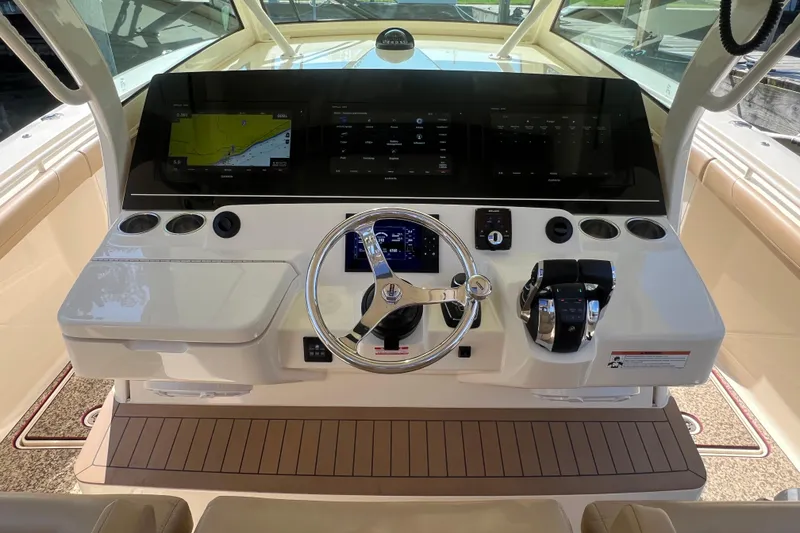 Slide: The Image of Helm of 2020 Scout 380 LXF boat with modern controls and navigation display. - 30