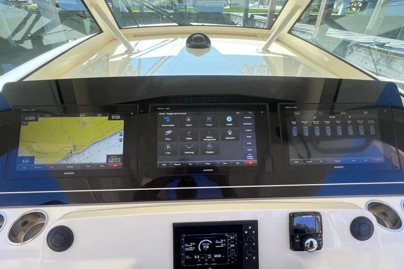 Slide: The Image of Helm of 2020 Scout 380 LXF with advanced Garmin navigation displays. - 31