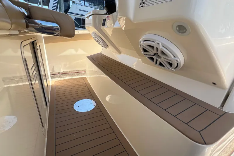 Slide: The Image of Interior view of 2020 Scout 380 LXF boat with teak flooring and speaker system. - 32