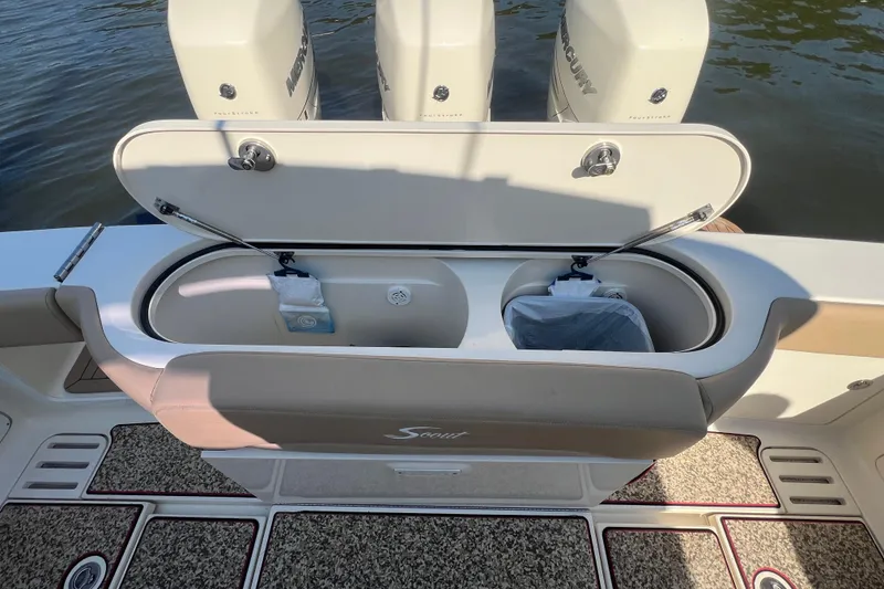 Slide: The Image of 2020 Scout 380 LXF boat with open storage compartment and Mercury engines. - 40