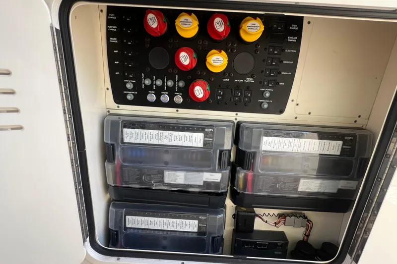 Slide: The Image of Electrical panel and battery storage on a 2020 Scout 380 LXF boat. - 42