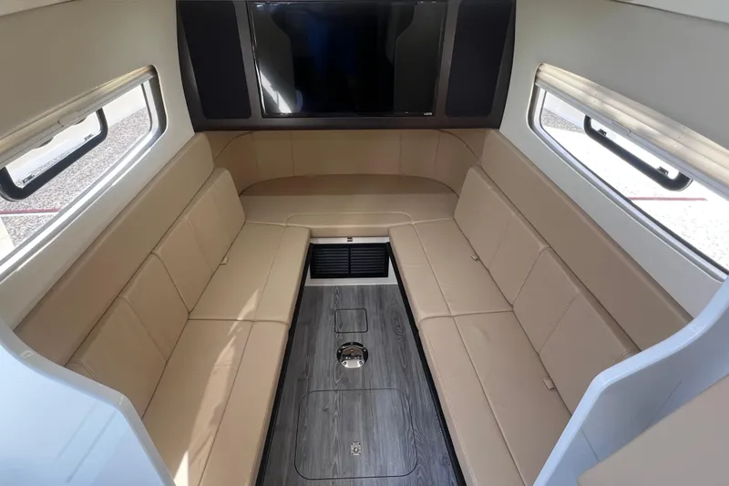 Slide: The Image of Luxurious interior of 2020 Scout 380 LXF boat with beige seating and modern design. - 43