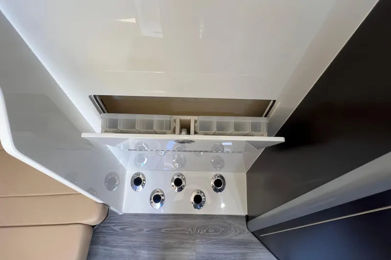 Slide: The Image of 2020 Scout 380 LXF interior storage compartment with multiple cup holders. - 50