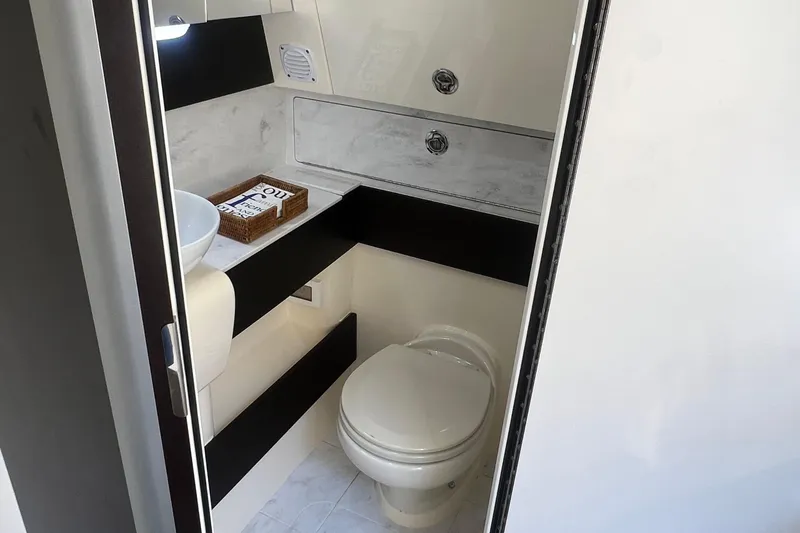 Slide: The Image of 2020 Scout 380 LXF boat bathroom with modern fixtures and sleek design. - 51